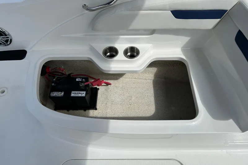 Slide: The Image of Storage compartment with battery in 2022 Hurricane SunDeck Sport 185 OB boat. - 16