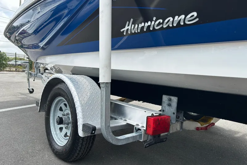Slide: The Image of 2022 Hurricane SunDeck Sport 185 OB boat on trailer, close-up view. - 18