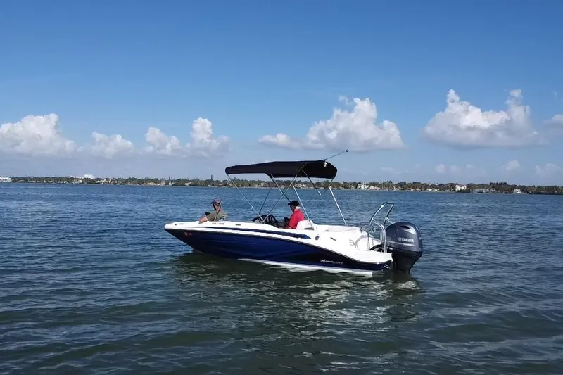 Slide: The Image of 2022 Hurricane SunDeck Sport 185 OB boat cruising on a sunny day. - 20