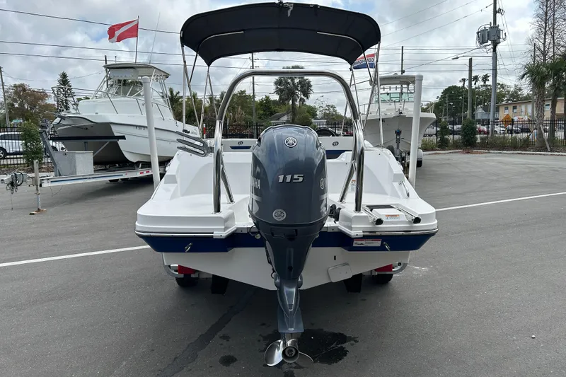 Slide: The Image of 2022 Hurricane SunDeck Sport 185 OB boat with Yamaha 115 engine, parked outdoors. - 3