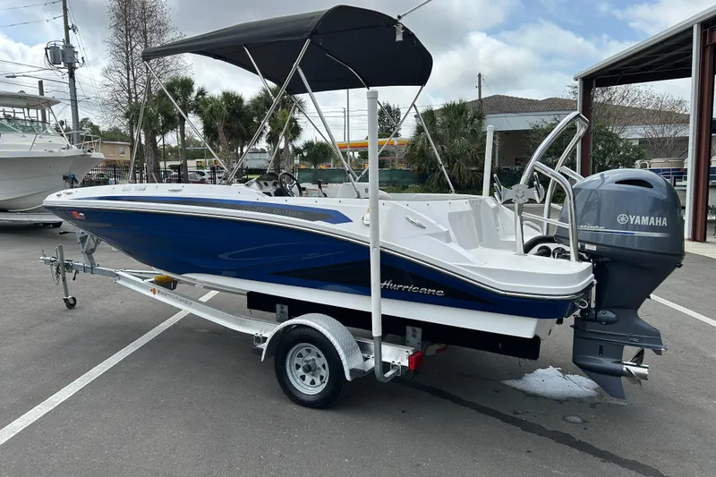 Slide: The Image of 2022 Hurricane SunDeck Sport 185 OB boat with Yamaha outboard motor on trailer. - 4