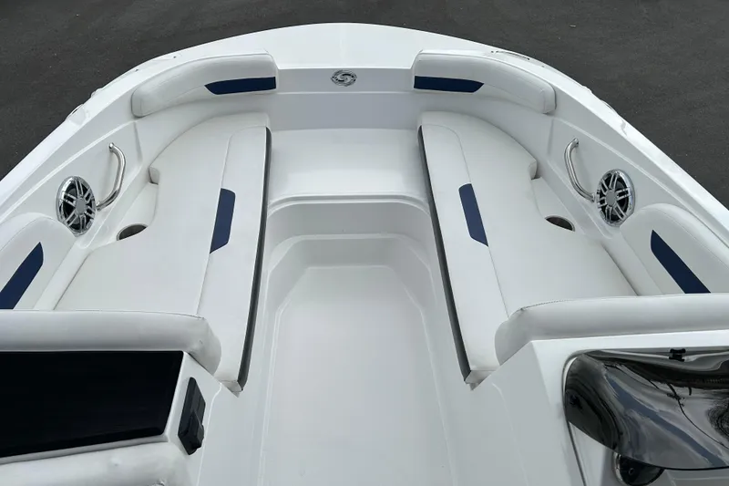 Slide: The Image of 2022 Hurricane SunDeck Sport 185 OB boat interior with white seating and blue accents. - 8
