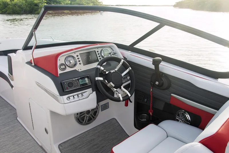Slide: The Image of Manufacturer Provided Image: 2016 Regal 27 FasDeck RX boat cockpit with modern controls and steering wheel. - 10