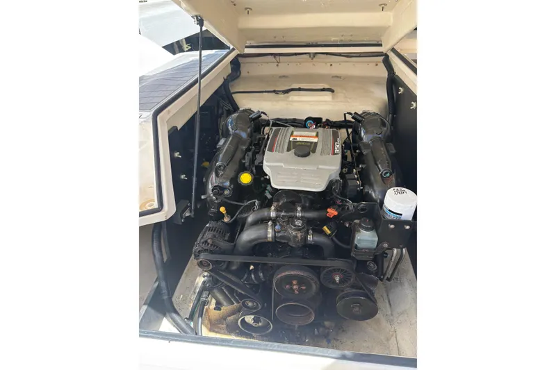 Slide: The Image of Engine compartment of a 2016 Regal 27 FasDeck RX boat, showcasing detailed mechanics. - 15