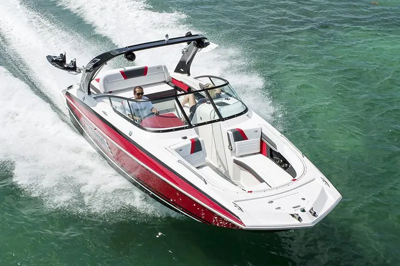 Slide: The Image of Manufacturer Provided Image: 2016 Regal 27 FasDeck RX speedboat cruising on clear water. - 6