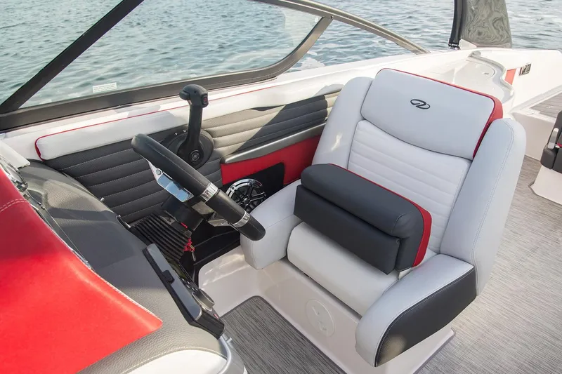Slide: The Image of Manufacturer Provided Image: 2016 Regal 27 FasDeck RX boat cockpit with steering wheel and captain's chair. - 9