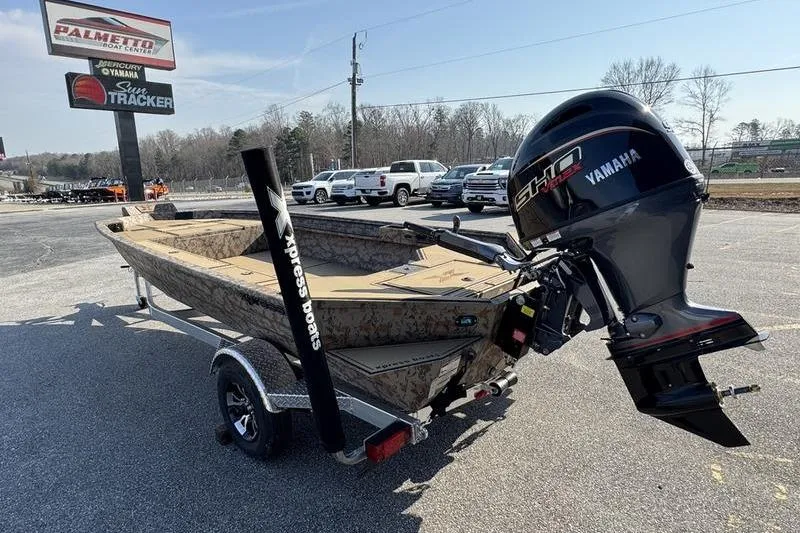 Slide: The Image of 2026 Xpress X18DB boat with Yamaha engine on trailer at dealership. - 3
