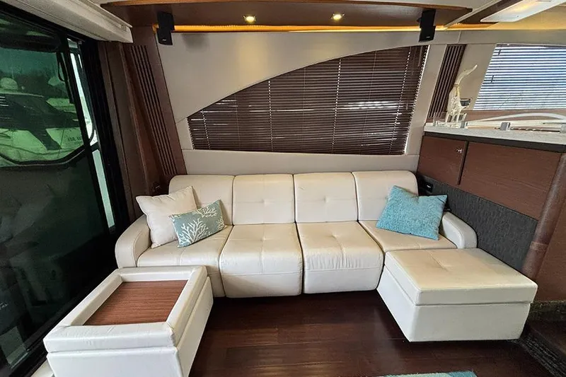 Slide: The Image of Luxurious interior of 2015 Sea Ray 510 Fly yacht with white leather seating and modern decor. - 16