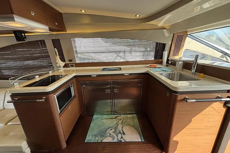 Slide: The Image of Luxurious kitchen interior of 2015 Sea Ray 510 Fly yacht with modern appliances. - 23