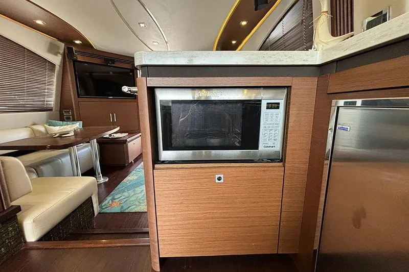 Slide: The Image of Luxurious interior of 2015 Sea Ray 510 Fly yacht with modern kitchen amenities. - 25