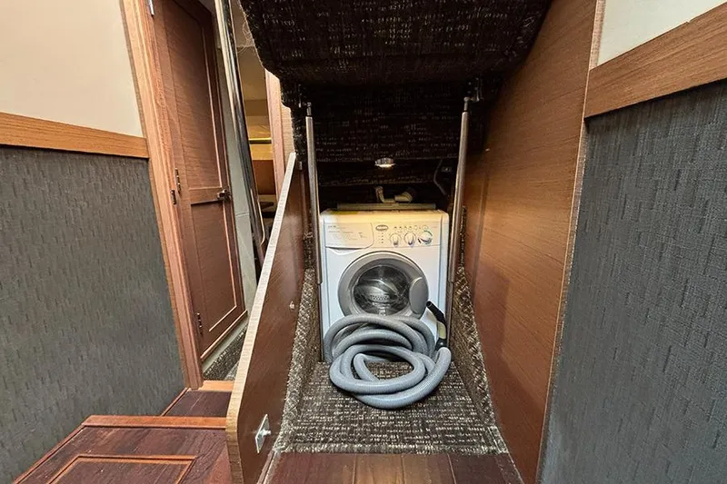 Slide: The Image of Laundry area with washing machine inside 2015 Sea Ray 510 Fly yacht. - 32