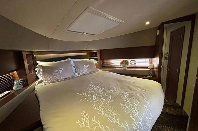 Slide: The Image of Luxurious bedroom interior of 2015 Sea Ray 510 Fly yacht with elegant bedding and decor. - 34