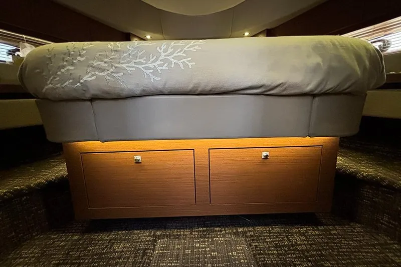 Slide: The Image of Luxurious bedroom interior of 2015 Sea Ray 510 Fly yacht with elegant bedding and storage. - 36