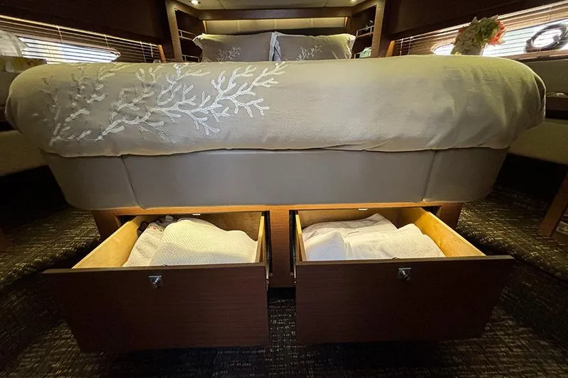 Slide: The Image of Luxurious 2015 Sea Ray 510 Fly yacht bedroom with under-bed storage drawers. - 37