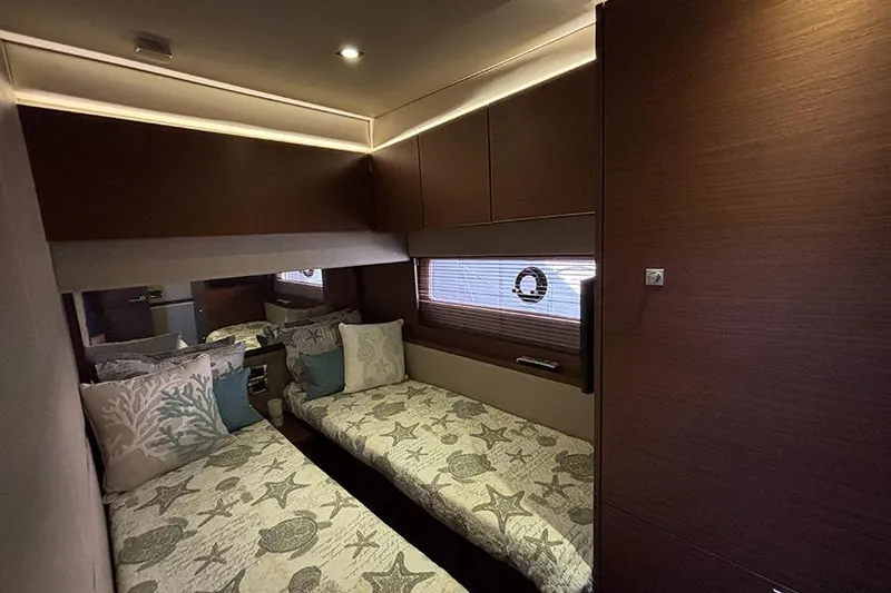 Slide: The Image of Luxurious 2015 Sea Ray 510 Fly cabin with twin beds and elegant decor. - 41