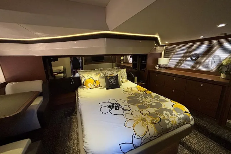 Slide: The Image of Luxurious 2015 Sea Ray 510 Fly yacht bedroom with elegant floral bedding and modern decor. - 45
