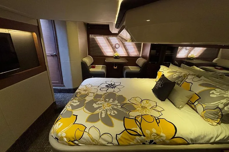 Slide: The Image of Luxurious 2015 Sea Ray 510 Fly yacht bedroom with floral bedding and elegant decor. - 48
