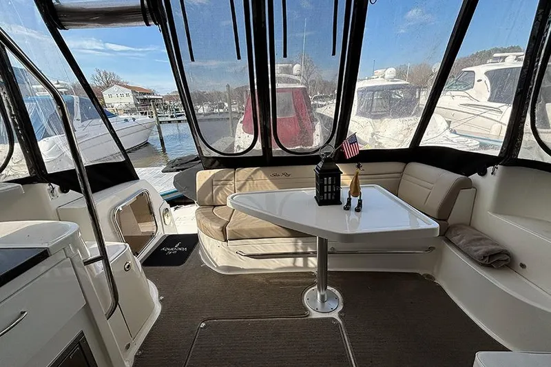 Slide: The Image of Interior of 2015 Sea Ray 510 Fly yacht with seating and table, docked at marina. - 5