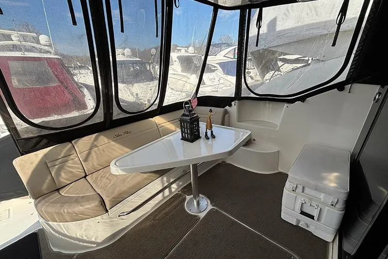 Slide: The Image of 2015 Sea Ray 510 Fly yacht interior with seating, table, and decor. - 6