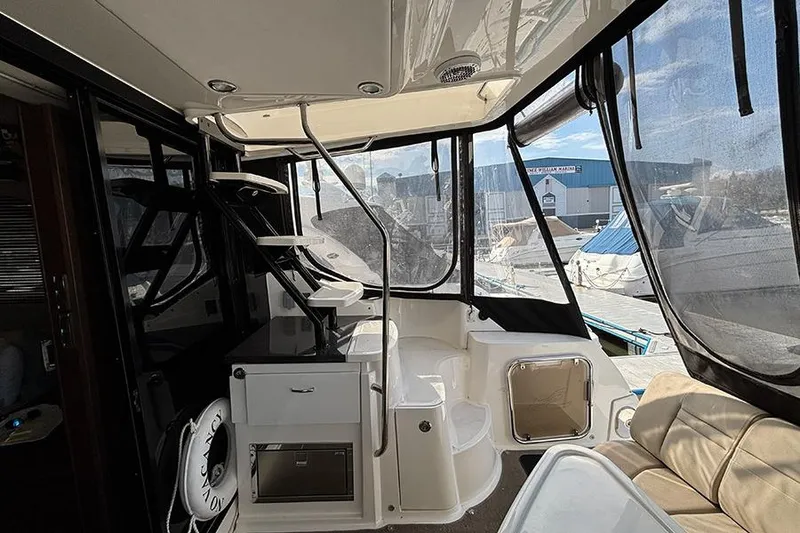 Slide: The Image of Interior view of 2015 Sea Ray 510 Fly yacht with seating and stairs. - 7