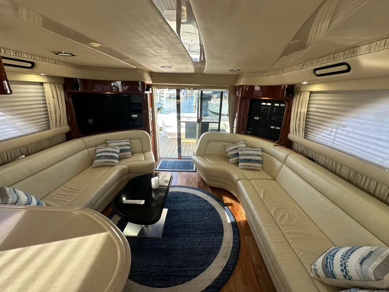 Slide: The Image of Engine room of 2002 Sea Ray 560 Sedan Bridge with fire extinguisher and electrical panel. - 18