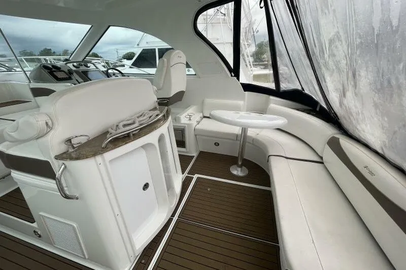 Slide: The Image of Interior of 2008 Cruisers Yachts 390 Express Coupe with seating and helm. - 10