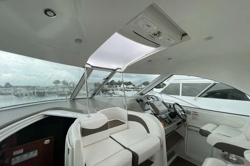 Slide: The Image of Interior view of 2008 Cruisers Yachts 390 Express Coupe with modern helm and seating. - 12