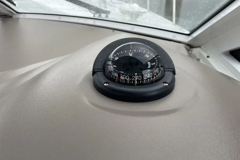 Slide: The Image of Compass on 2008 Cruisers Yachts 390 Express Coupe dashboard, showing navigation directions. - 15
