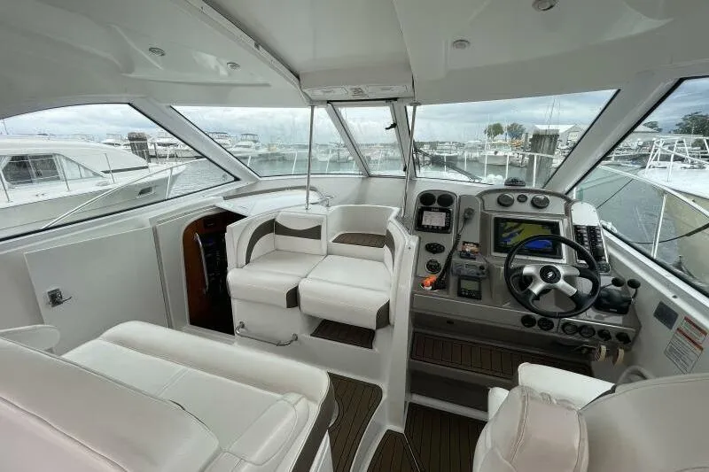 Slide: The Image of 2008 Cruisers Yachts 390 Express Coupe cockpit with modern controls and seating. - 16