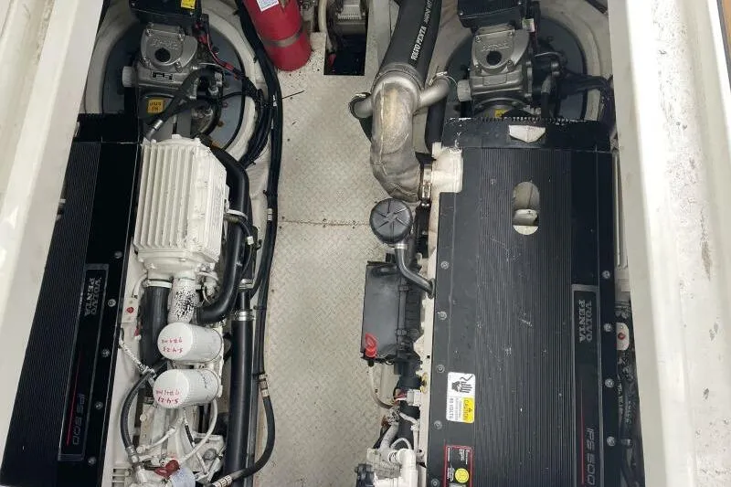 Slide: The Image of Engine compartment of 2008 Cruisers Yachts 390 Express Coupe with visible components. - 25