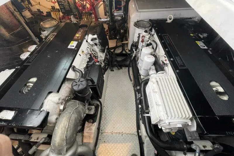 Slide: The Image of Engine room of a 2008 Cruisers Yachts 390 Express Coupe, showcasing dual engines. - 26