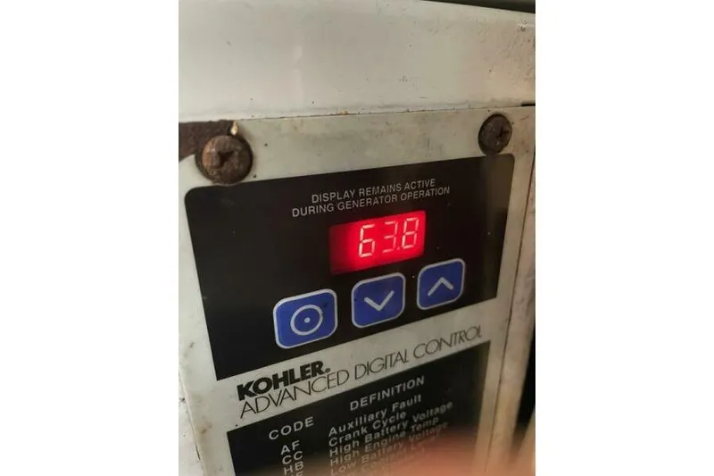 Slide: The Image of Kohler generator control panel displaying "638" on a 2008 Cruisers Yachts 390 Express Coupe. - 32