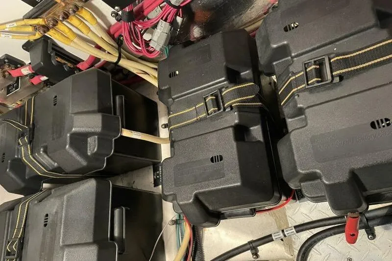 Slide: The Image of Battery compartment of a 2008 Cruisers Yachts 390 Express Coupe with cables and connectors. - 34