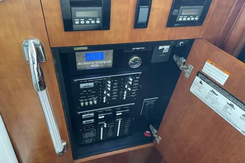 Slide: The Image of Electrical control panel inside 2008 Cruisers Yachts 390 Express Coupe. - 36