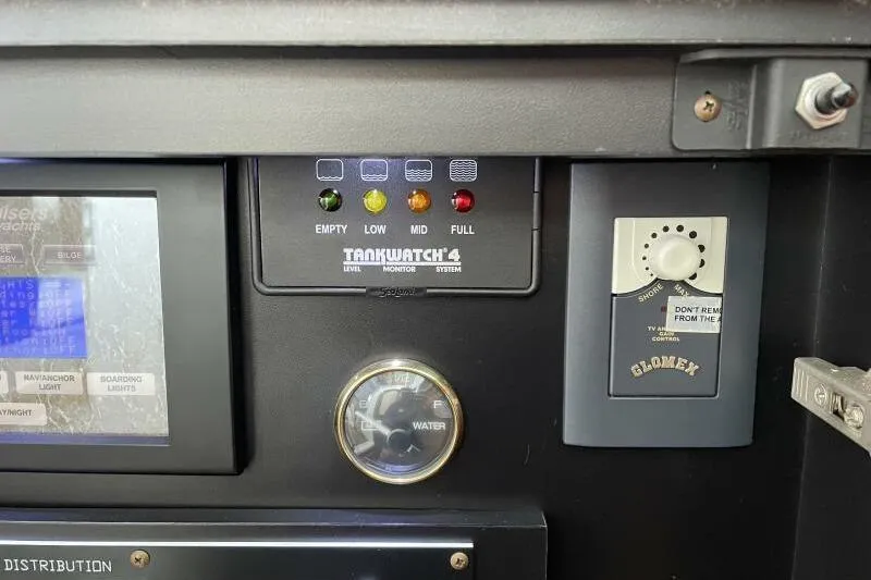 Slide: The Image of Control panel of 2008 Cruisers Yachts 390 Express Coupe with Tankwatch 4 system. - 38