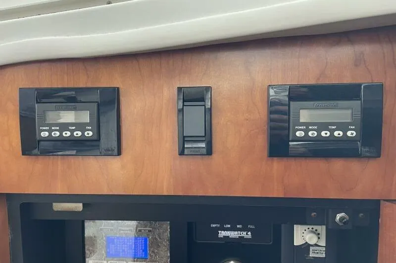 Slide: The Image of Control panel of a 2008 Cruisers Yachts 390 Express Coupe with digital displays. - 39