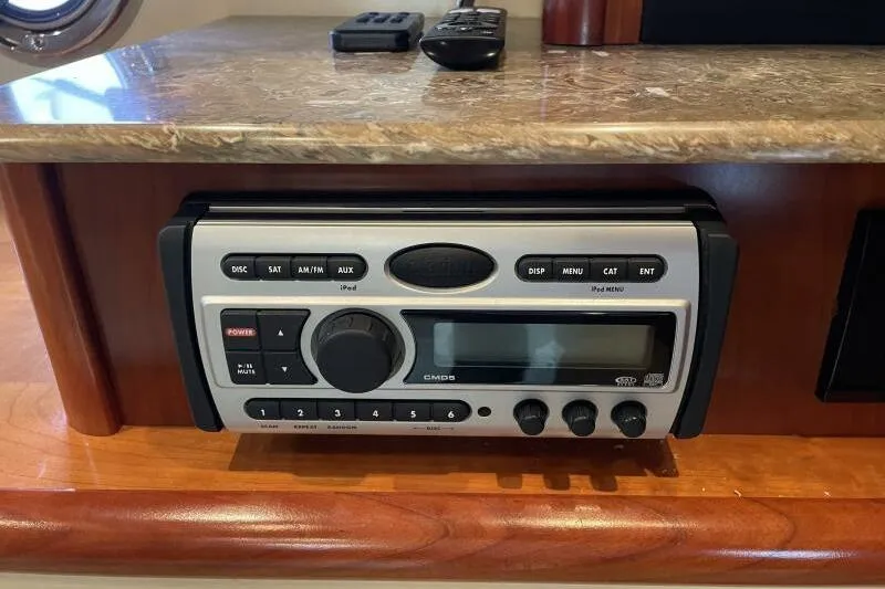Slide: The Image of Audio system in 2008 Cruisers Yachts 390 Express Coupe interior, featuring control panel and remotes. - 40