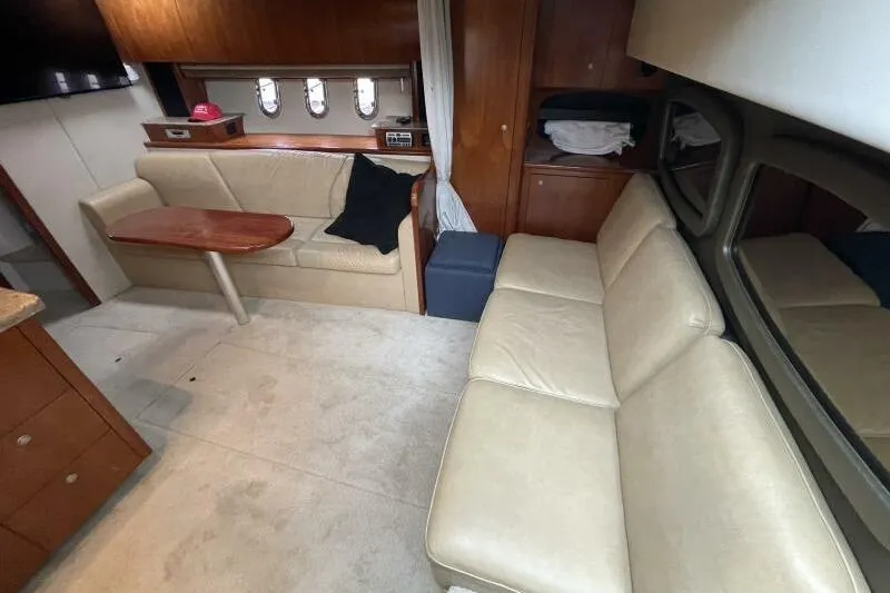 Slide: The Image of Luxurious interior of 2008 Cruisers Yachts 390 Express Coupe with beige seating and wooden accents. - 42