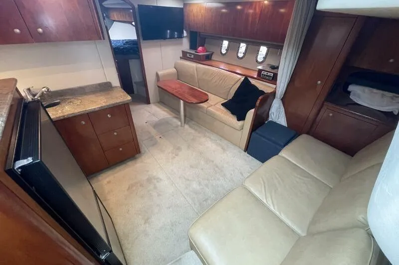 Slide: The Image of Luxurious interior of 2008 Cruisers Yachts 390 Express Coupe with leather seating and wood accents. - 44