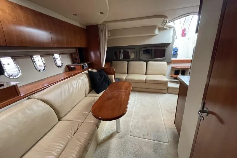 Slide: The Image of Luxurious interior of 2008 Cruisers Yachts 390 Express Coupe with leather seating and wooden accents. - 45