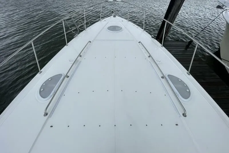 Slide: The Image of Bow view of 2008 Cruisers Yachts 390 Express Coupe docked on calm water. - 5