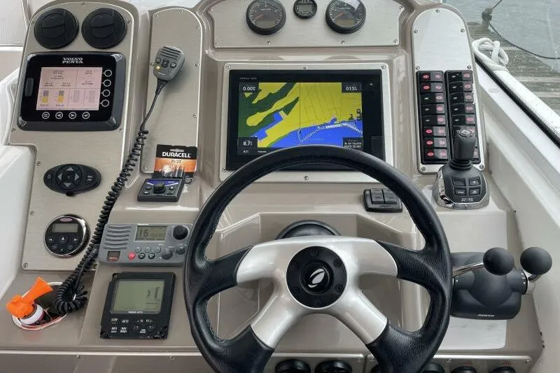 Slide: The Image of Cockpit of 2008 Cruisers Yachts 390 Express Coupe with navigation and control systems. - 53