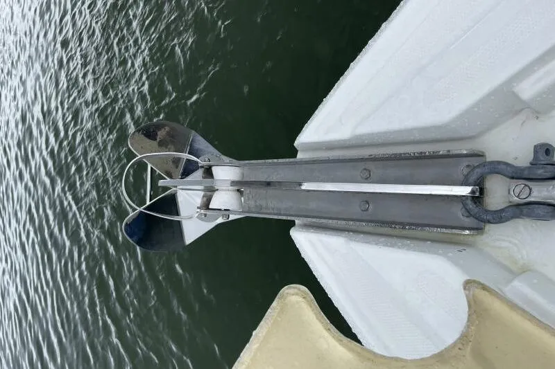 Slide: The Image of Anchor system on 2008 Cruisers Yachts 390 Express Coupe, positioned over water. - 6