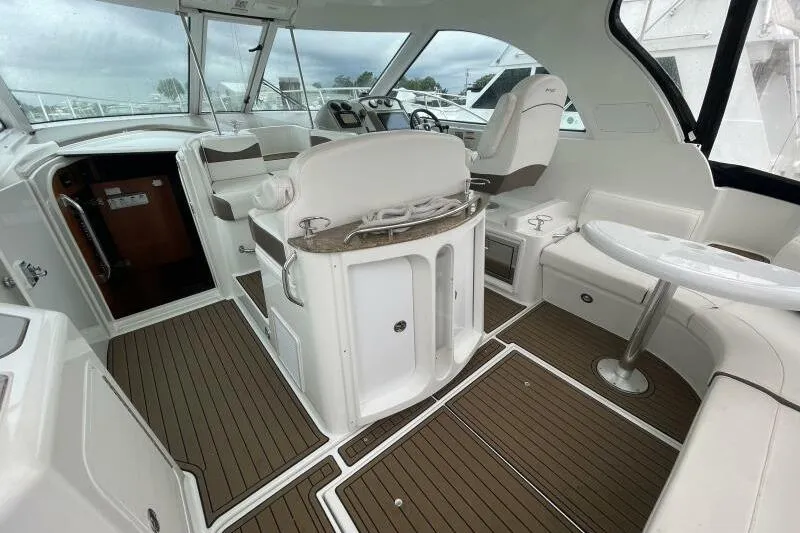 Slide: The Image of Interior of 2008 Cruisers Yachts 390 Express Coupe with modern seating and helm. - 9