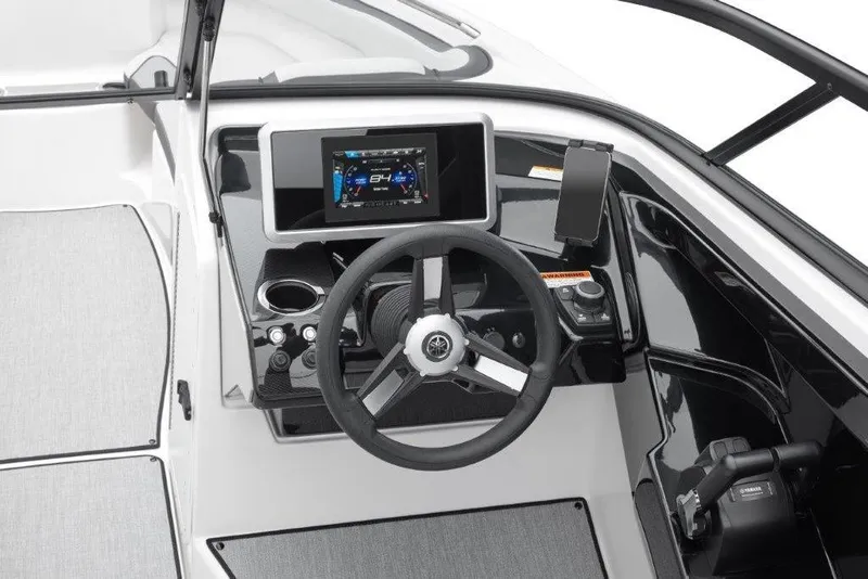 Slide: The Image of 2026 Yamaha Boats AR250 dashboard with steering wheel and digital display. - 5