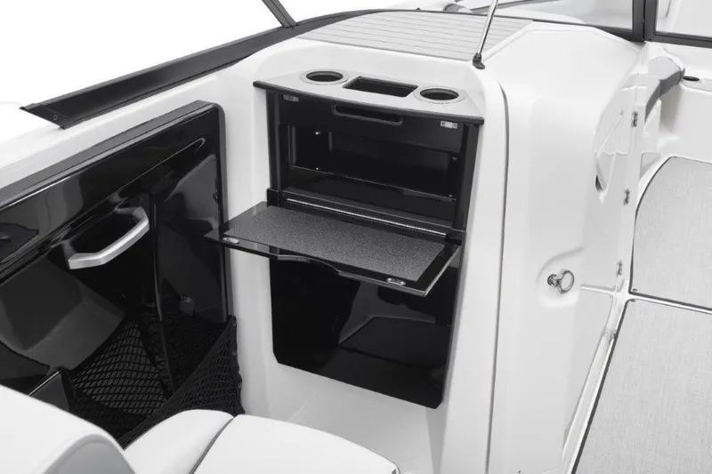 Slide: The Image of Interior of 2026 Yamaha AR250 boat with storage compartment and cup holders. - 8