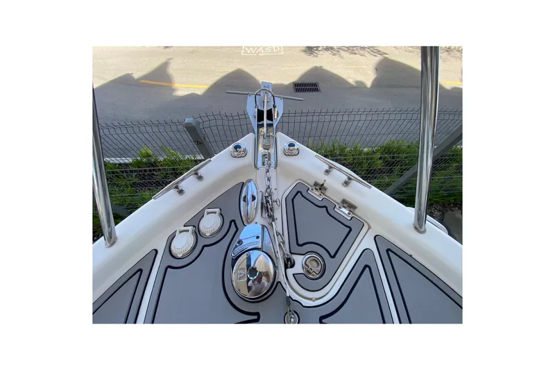 Slide: The Image of 2007 Robalo R265 Walkaround boat deck with anchor and stainless steel fittings. - 17