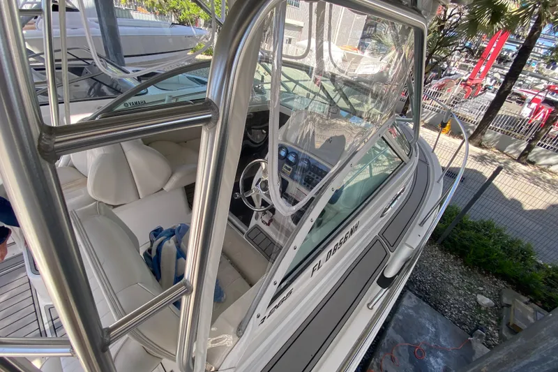 Slide: The Image of 2007 Robalo R265 Walkaround boat interior with steering wheel and seating. - 19