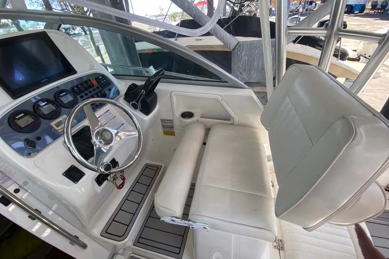 Slide: The Image of 2007 Robalo R265 Walkaround boat interior with steering wheel and control panel. - 27