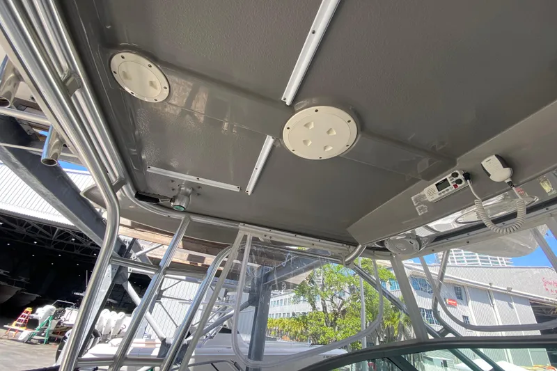 Slide: The Image of 2007 Robalo R265 Walkaround boat interior, featuring ceiling details and equipment. - 35